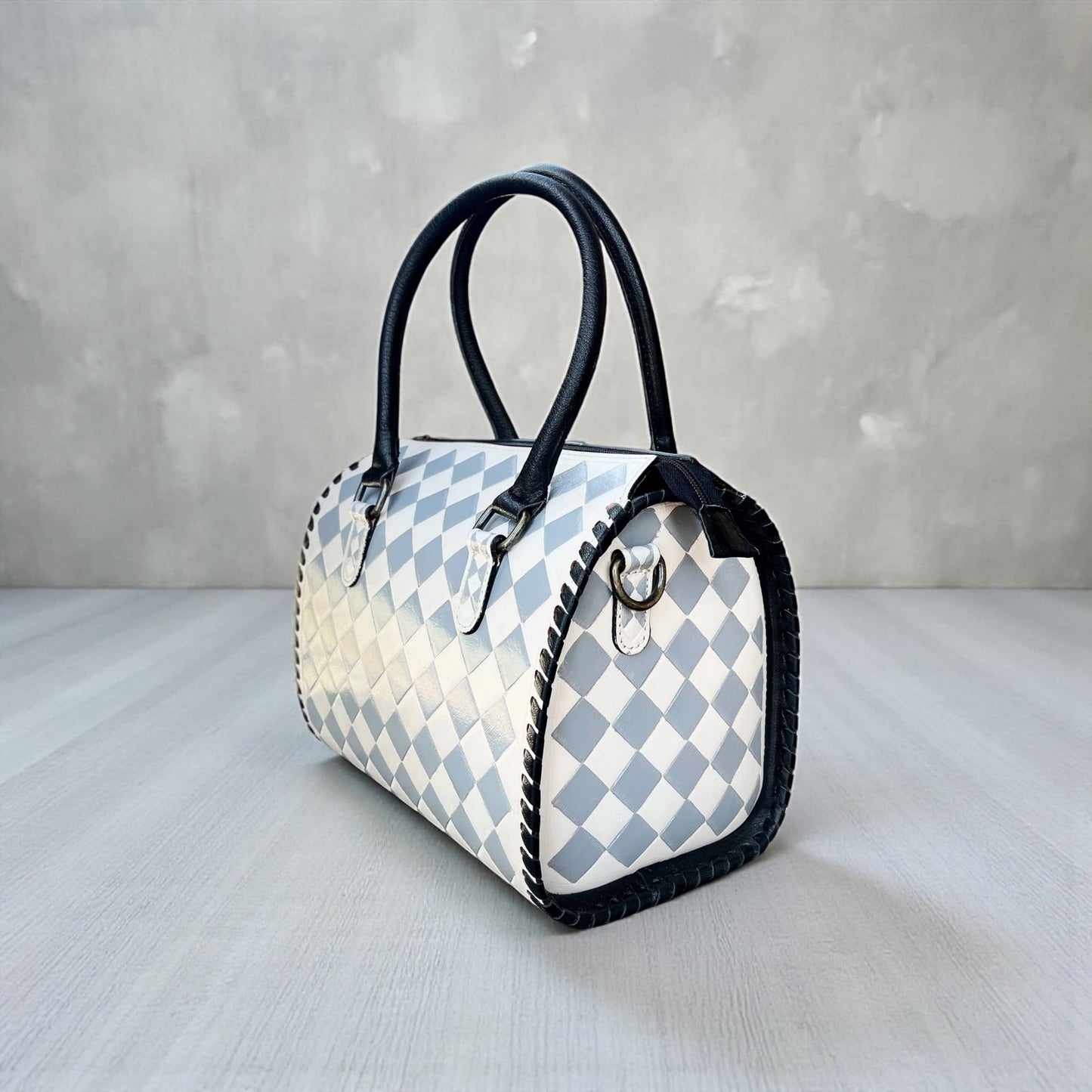 Gray checker tooled bag